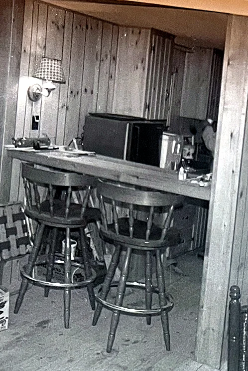 The kitchen and the bar top. Those two chairs stayed until the early 2010s, when they were retired because nobody ever used them. Note the o…